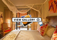 Bedroom in a Waterhole Facing room at Victoria Falls Safari Lodge