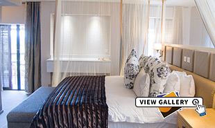 bedroom and balcony of the Luxury Room at the Elephant Hills hotel