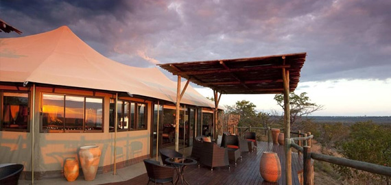 Luxury tent with sky and bushveld in background