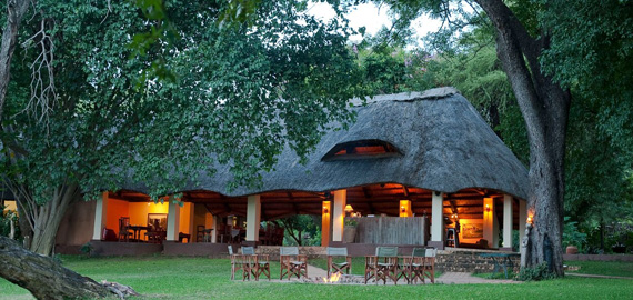 View of lodge in with lights on in the evening
