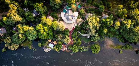 Aerial view of lodge next to river