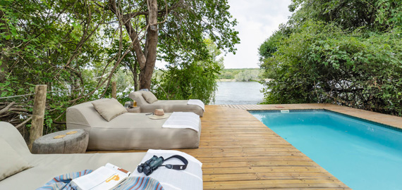 Swimming pool with view of river behind